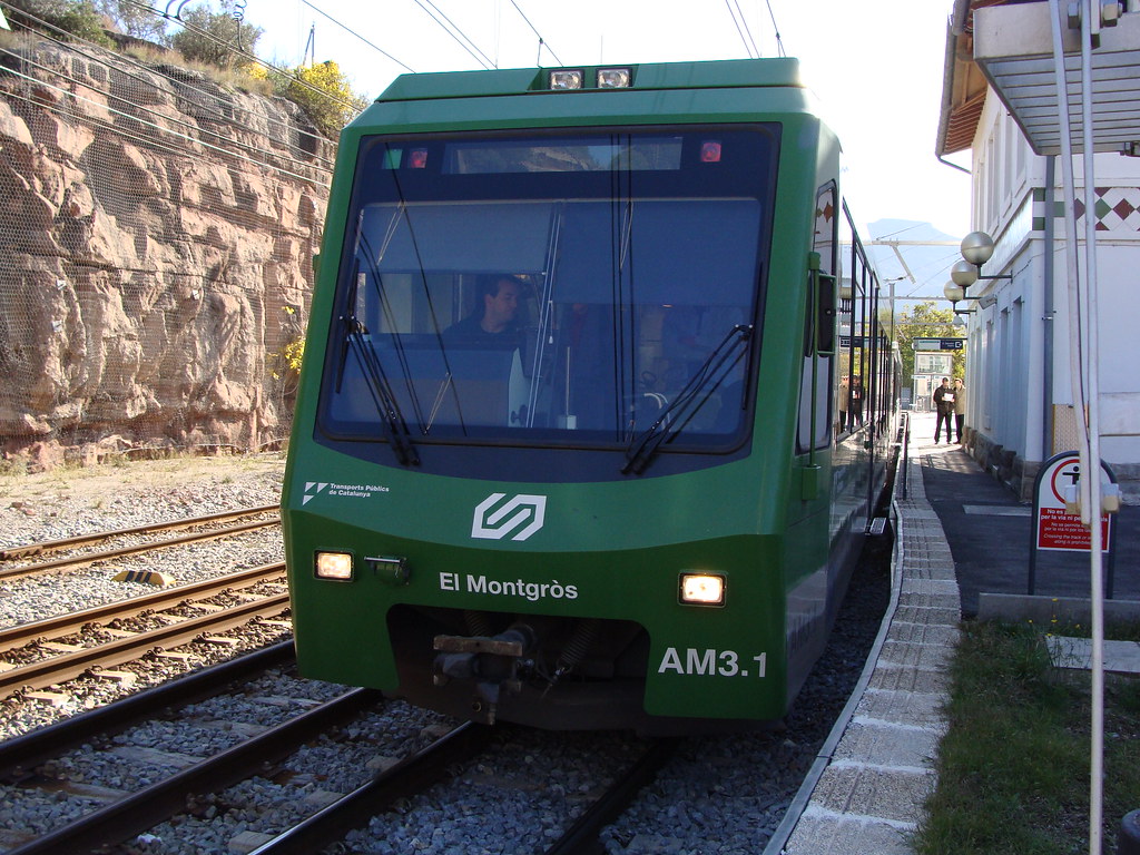 A Cremallera de Montserrat rack railway train below the Montserrat massif.