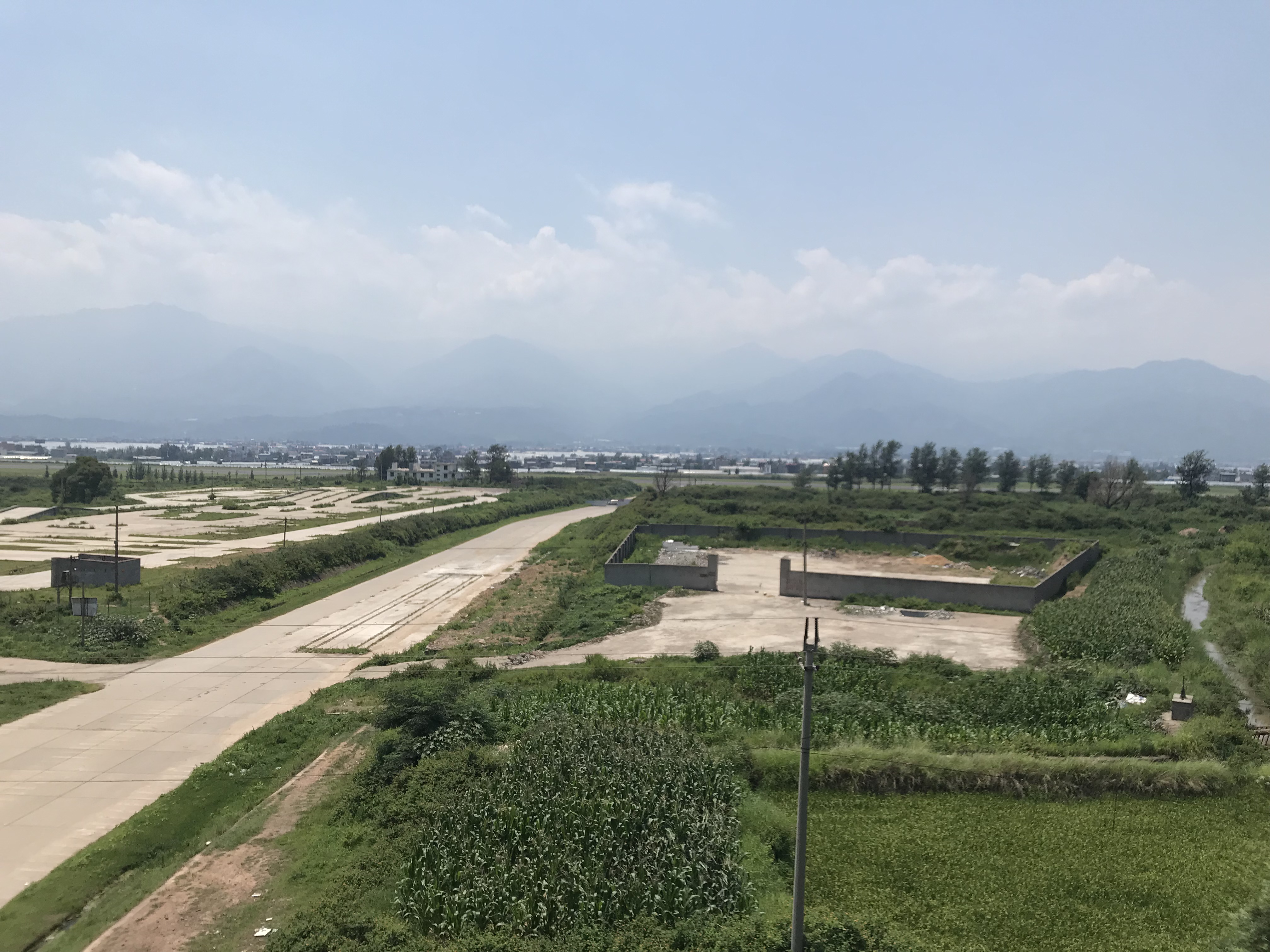 A slow green train on the Chengdu–Kunming railway in Sichuan.