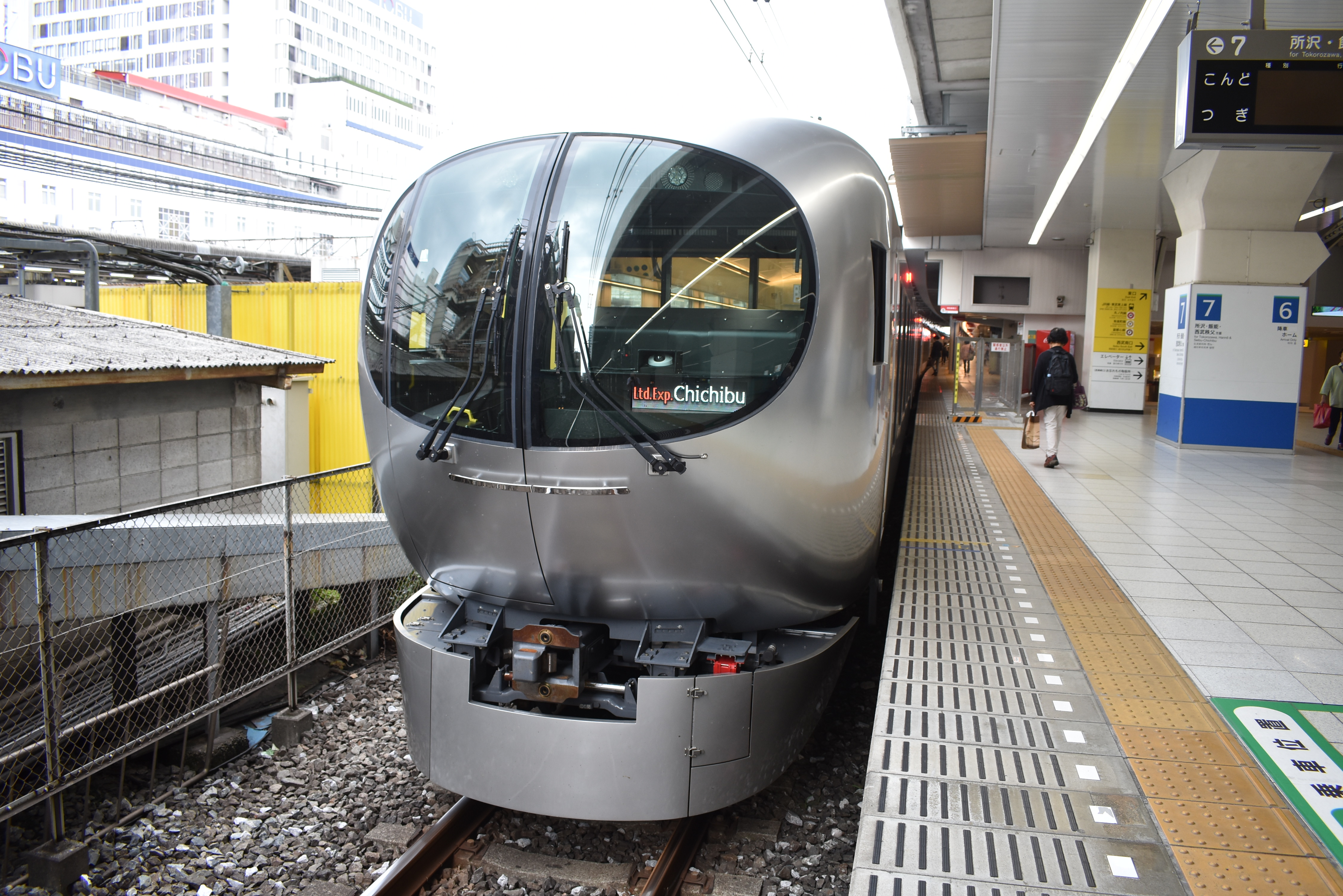 The curved glass nose of a Seibu 001 series Laview standing at Seibu-Chichibu with a Chichibu headboard.