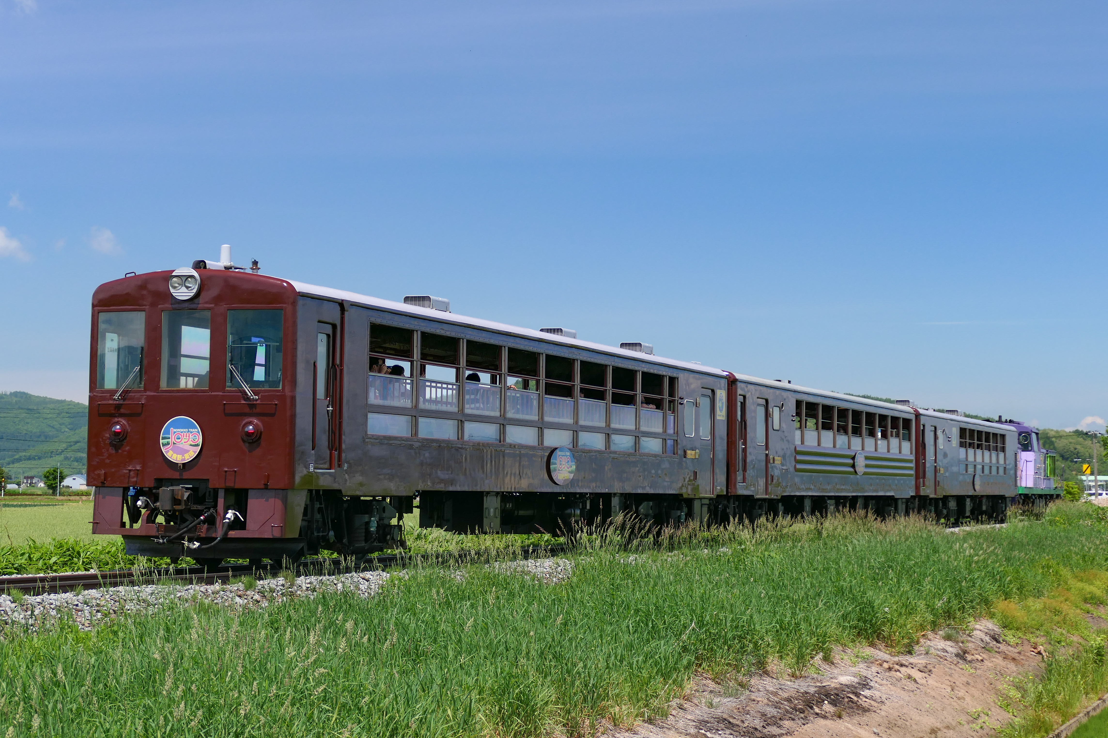 Furano Biei Norokko No. 2 train on the Furano Line between Gakuden and Shikauchi in Hokkaido, Japan.