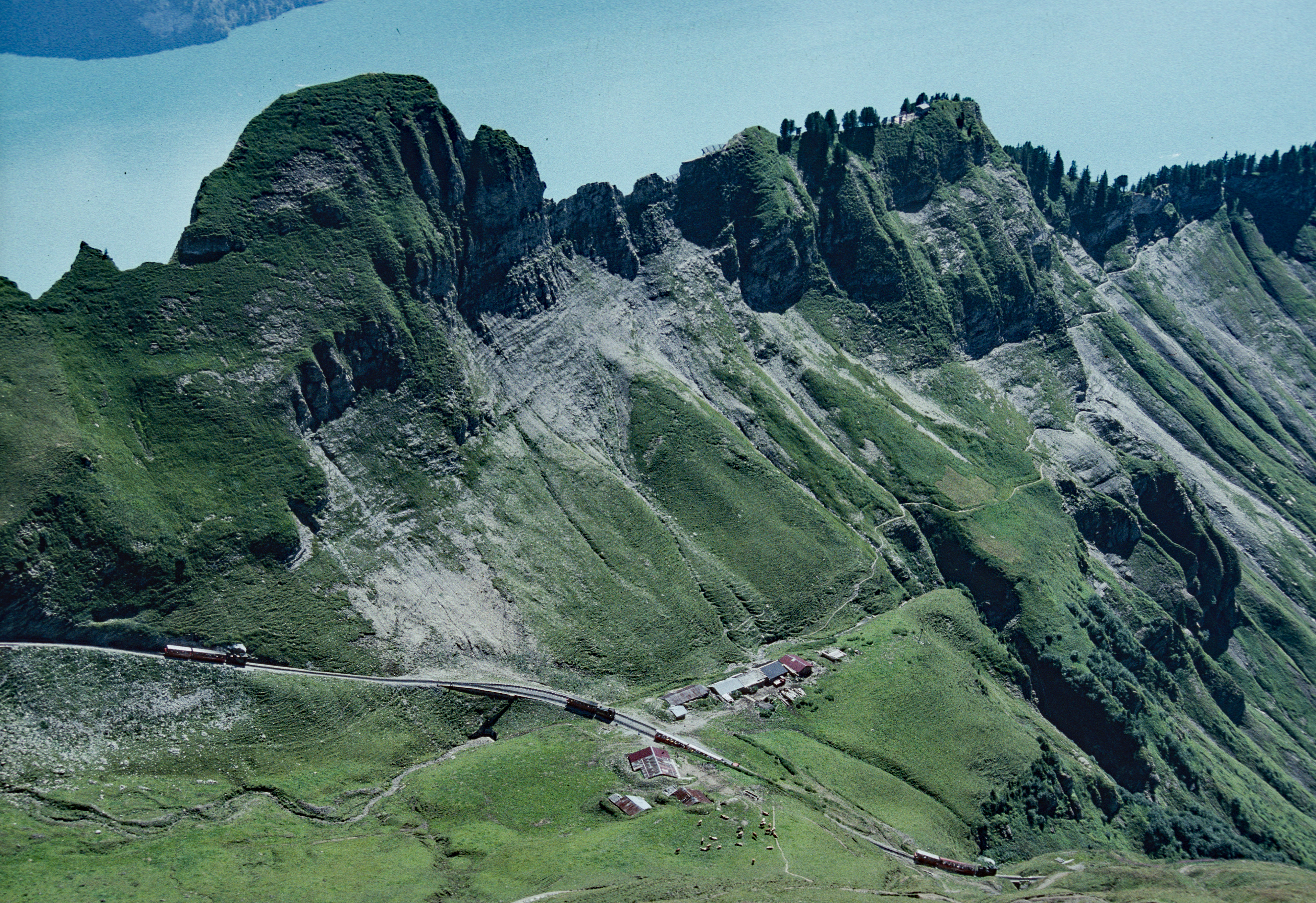 A steam train on the Brienz Rothorn Railway high above Planalp in the Swiss Alps.