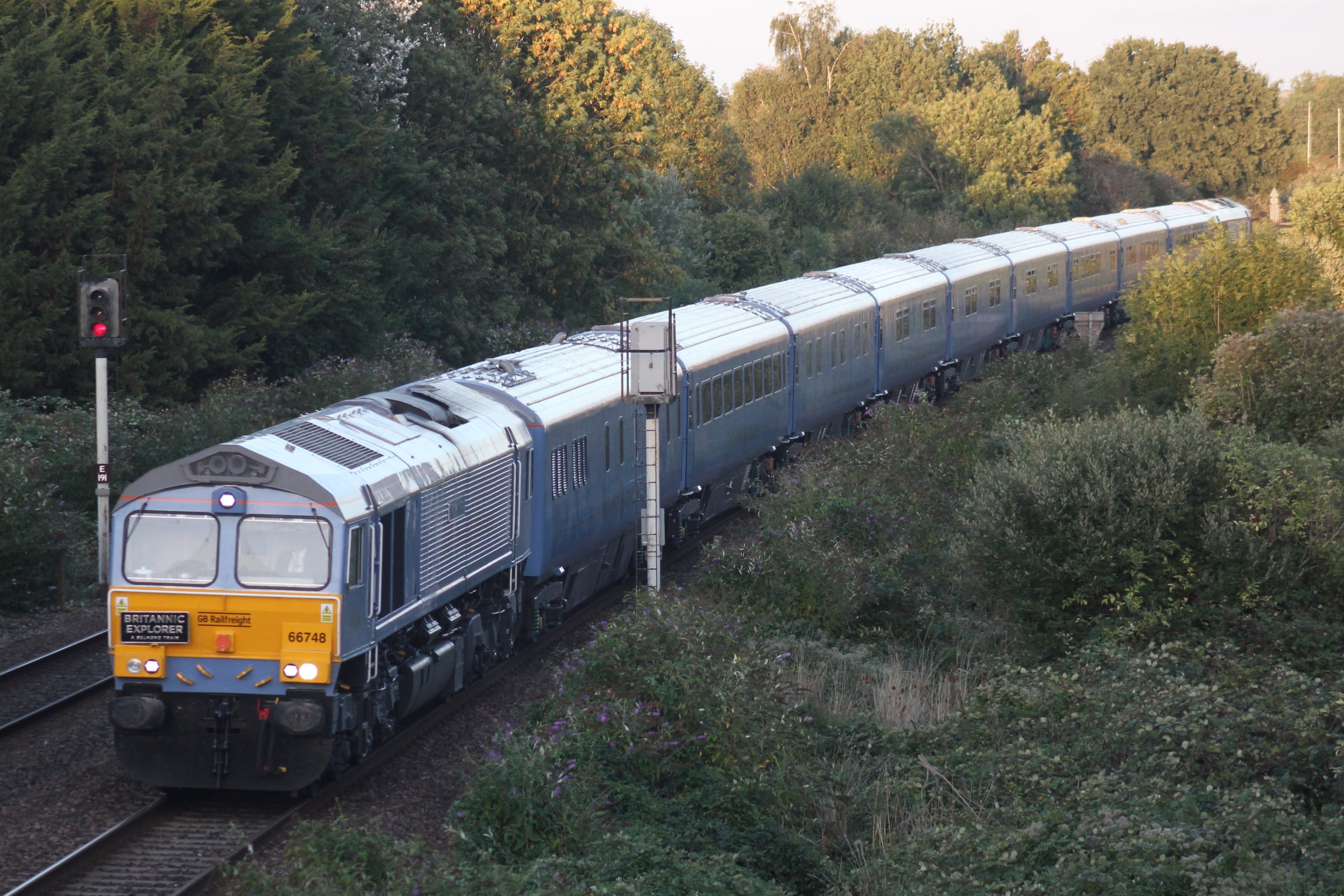 The Britannic Explorer luxury train running through the English countryside near Bathpool.