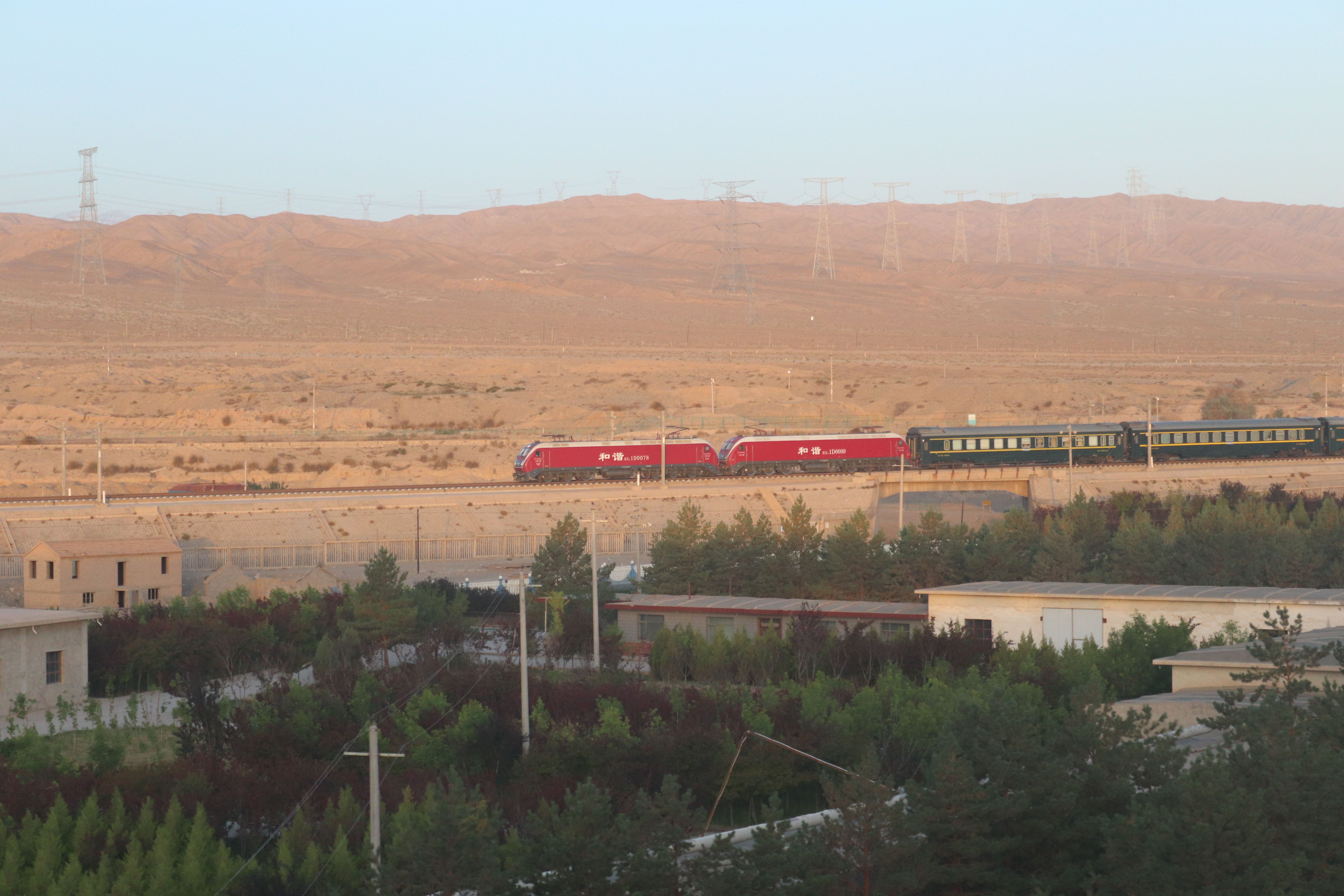A high-speed train on the Lanxin high-speed line approaching Jiayuguan South in the Gobi.