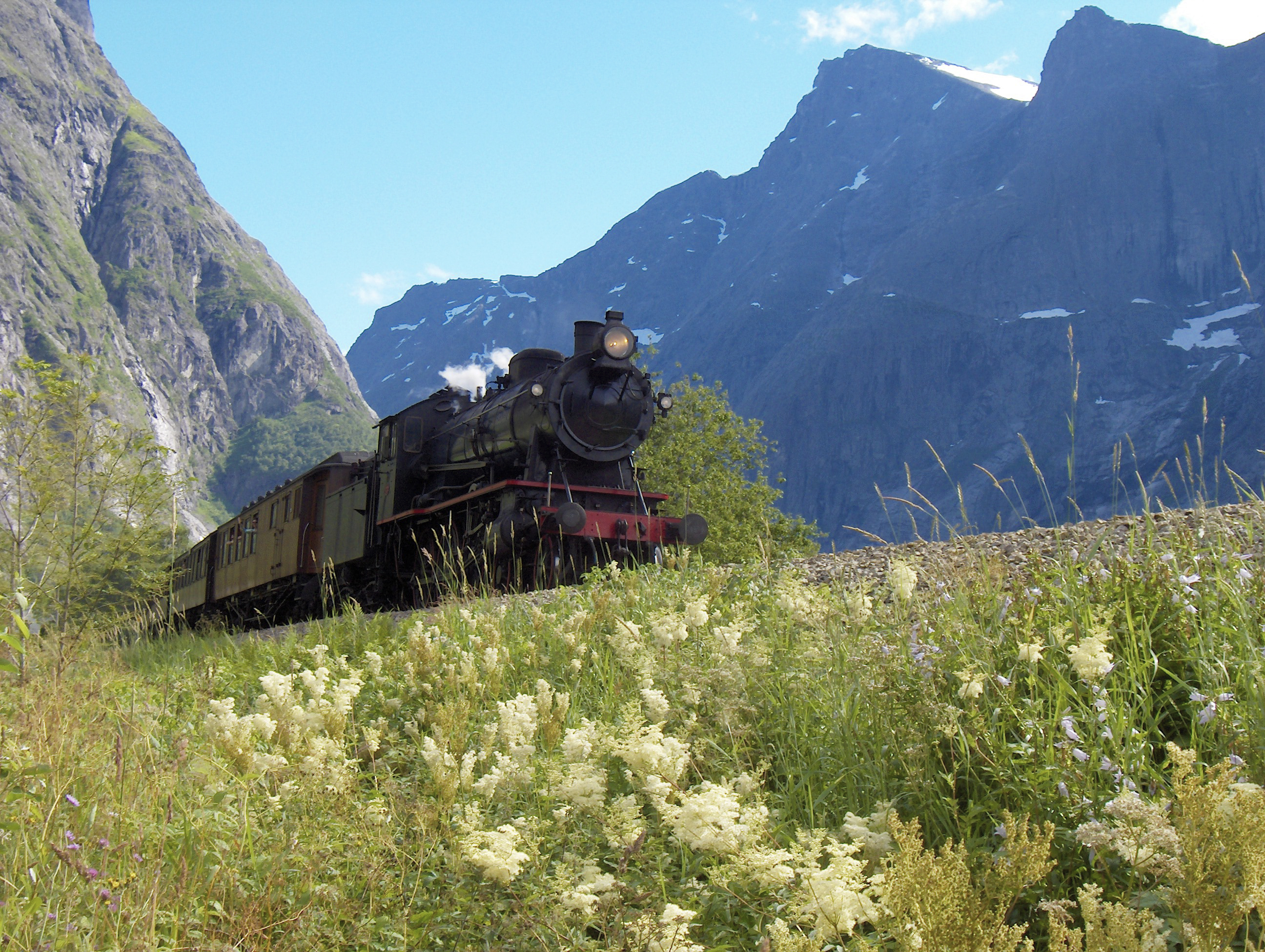A passenger train on the Rauma Line between Dombås and Åndalsnes in Norway.