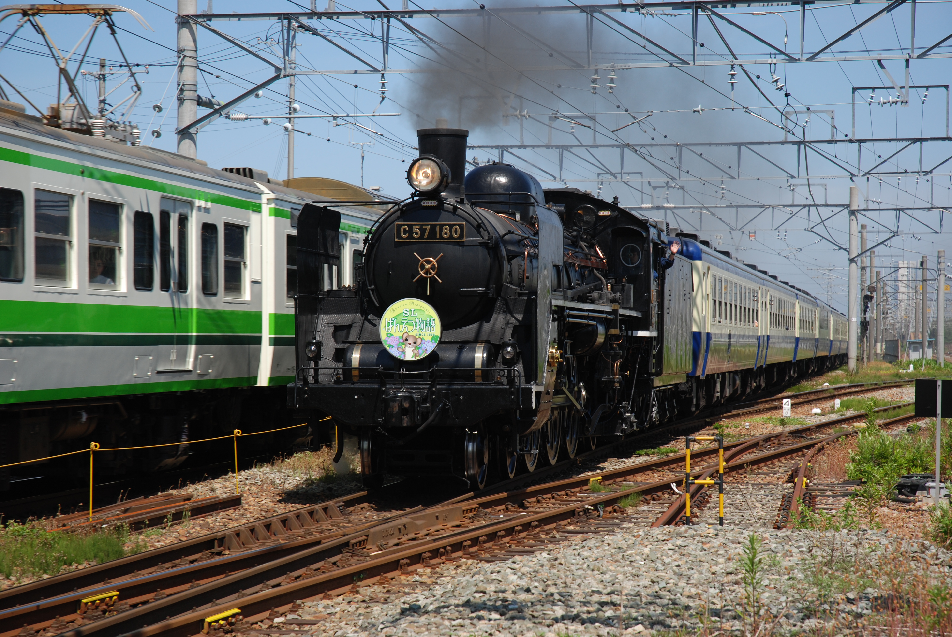 JR East SL Banetsu Monogatari hauled by steam locomotive C57 180 near Echigo-Ishiyama in Japan.