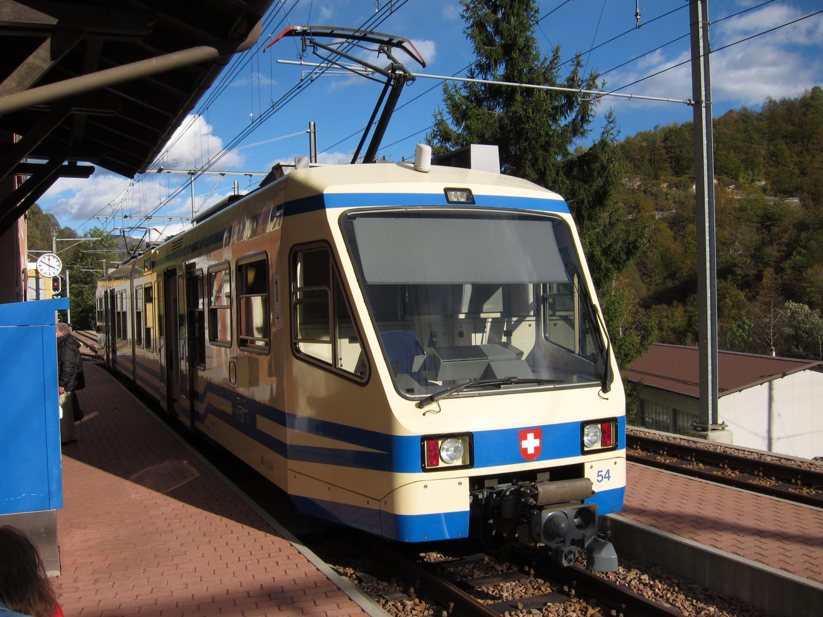 A Centovalli Railway (FART/SSIF) train passes through Camedo on the Locarno–Domodossola line.