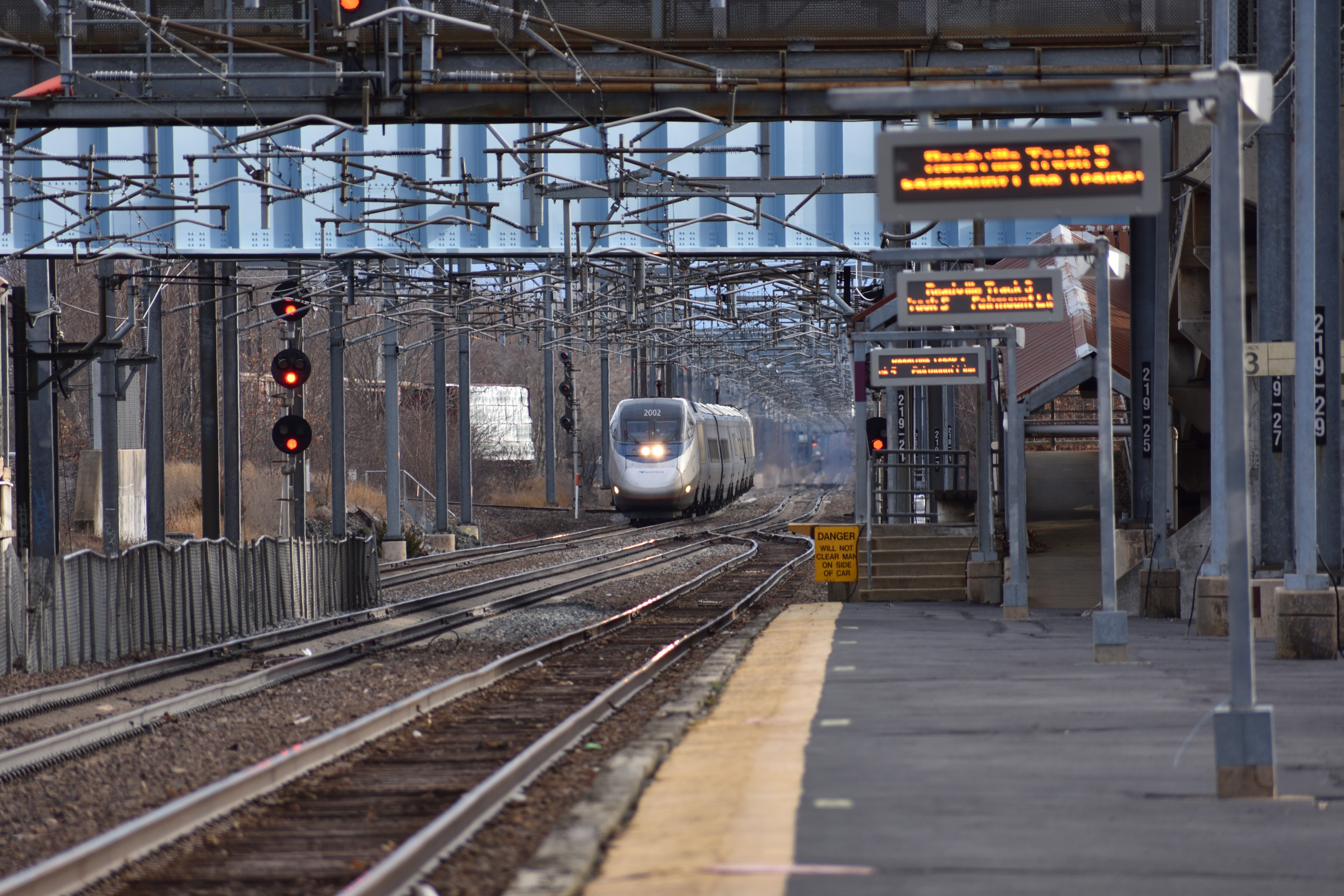 A northbound Amtrak Acela approaches Readville, Massachusetts, on the Northeast Corridor.