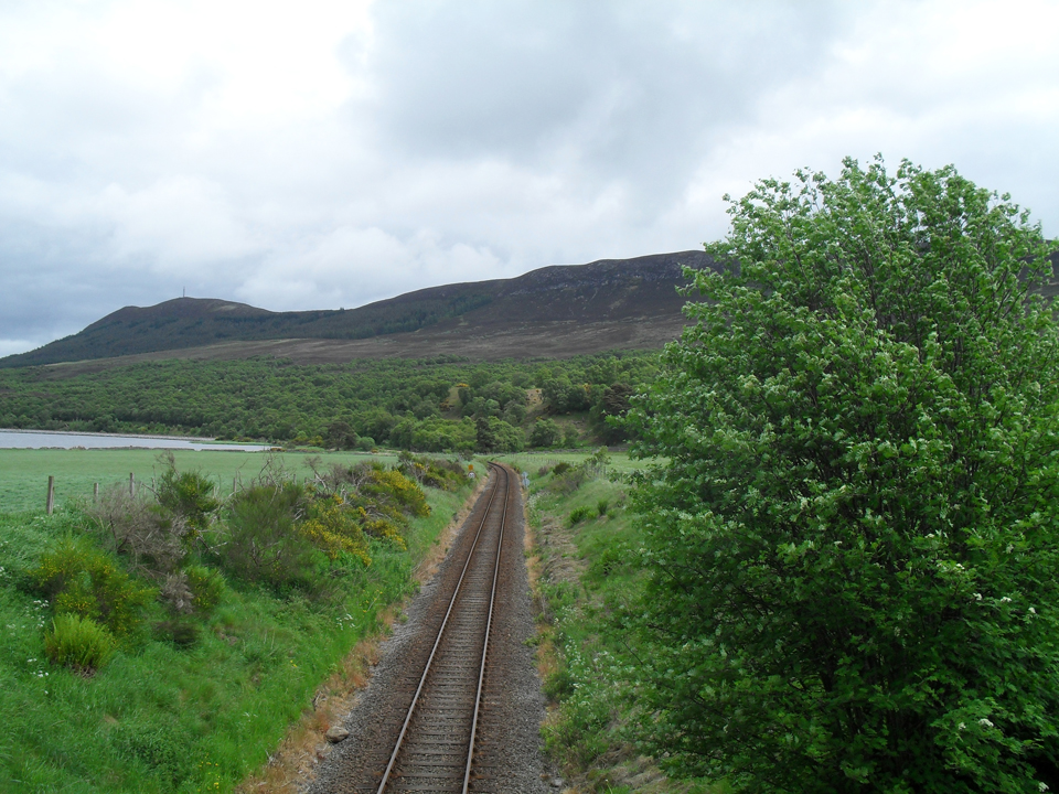 The Far North Line beneath the Struie in the Scottish Highlands.
