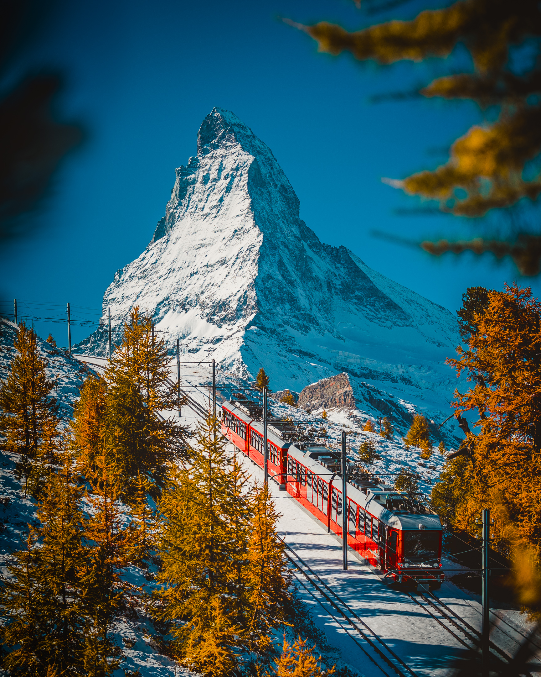 A Gornergrat Railway train with the Matterhorn beyond.