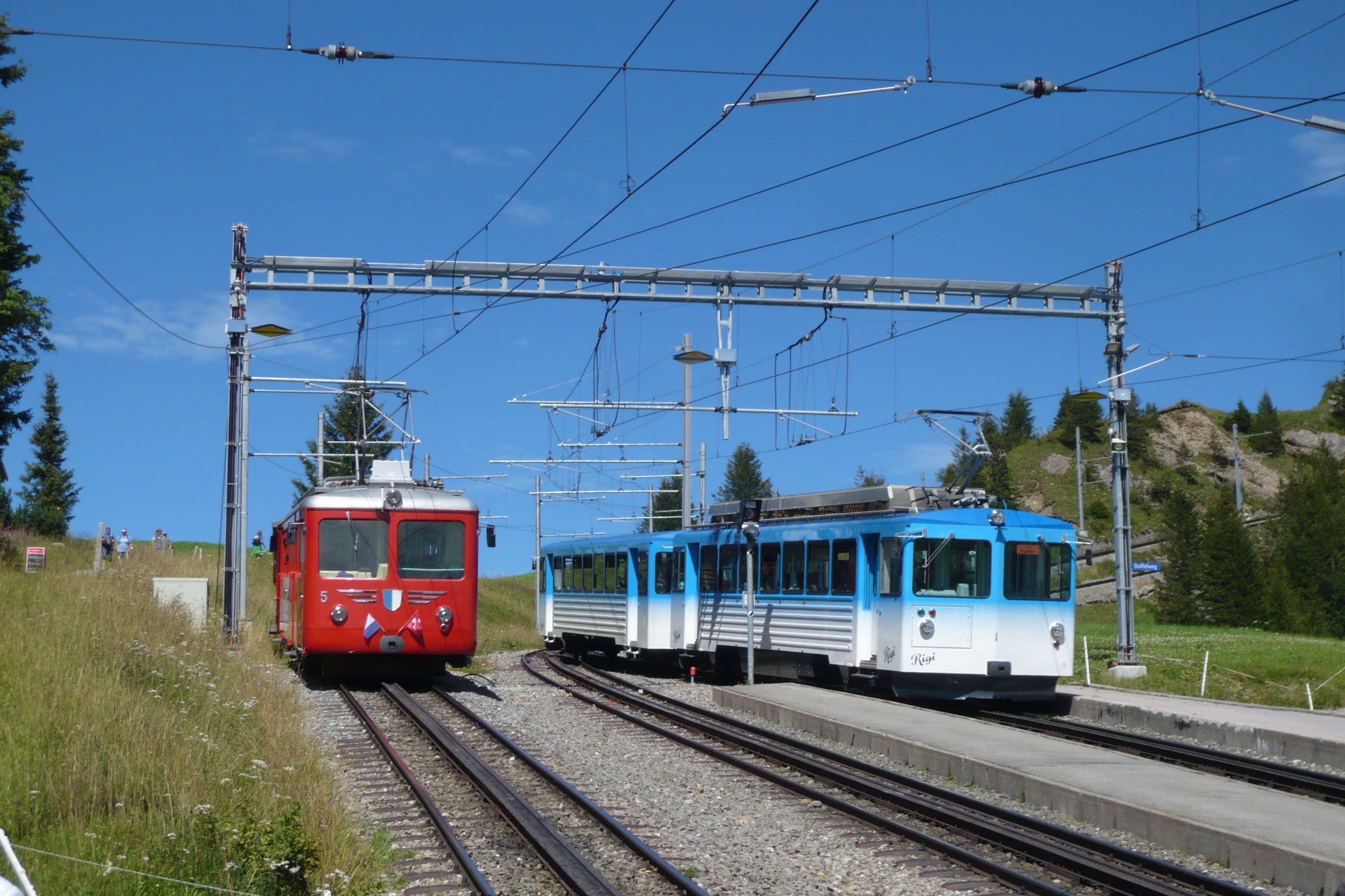 Rigi Railways trains climbing together toward Rigi Kulm.
