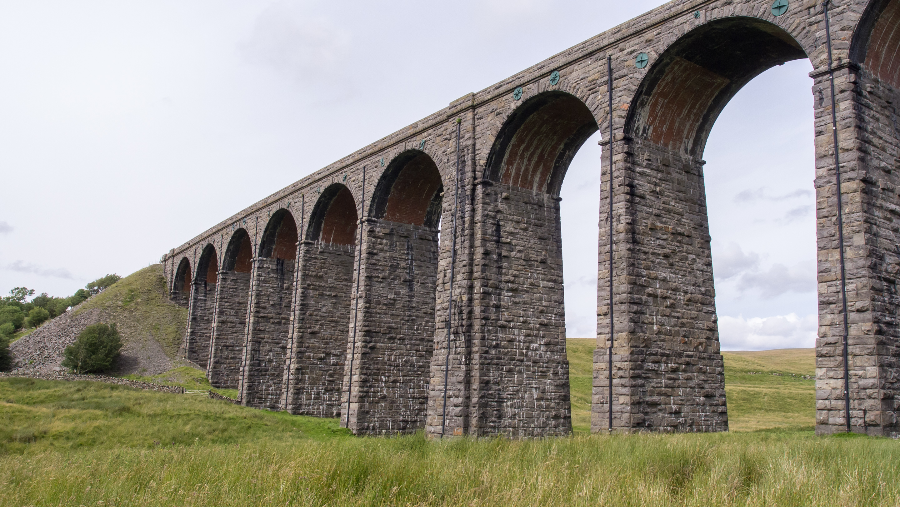 A train crosses the Ribblehead Viaduct on the Settle–Carlisle Line in the Yorkshire Dales.