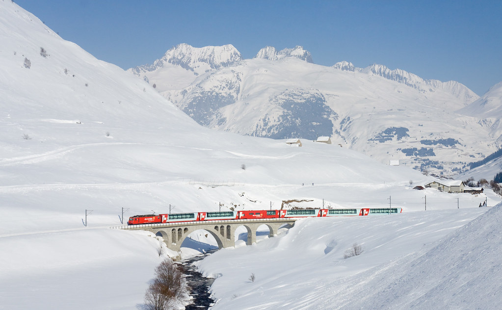 The Glacier Express travelling through the Urseren Valley in Switzerland.