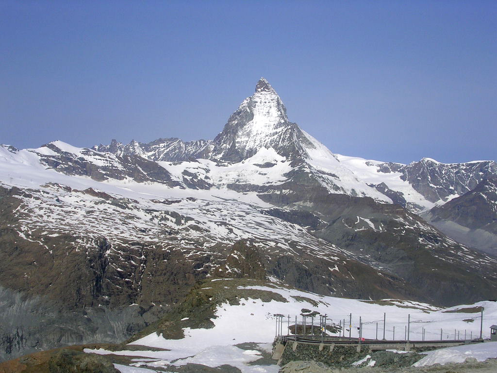 A Gornergrat Railway train with the Matterhorn beyond.