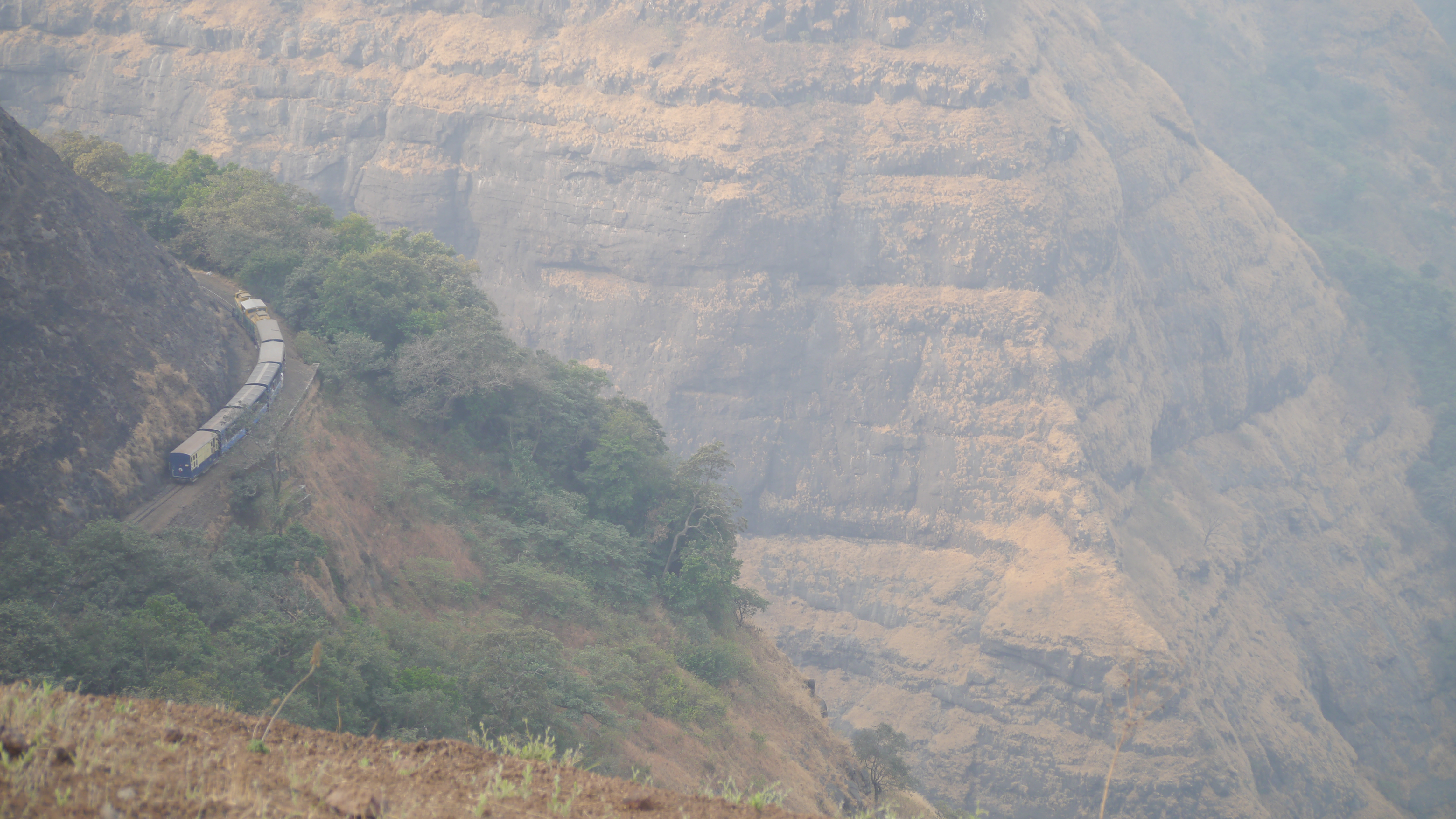 The Matheran toy train curving through the Western Ghats on its hill railway.
