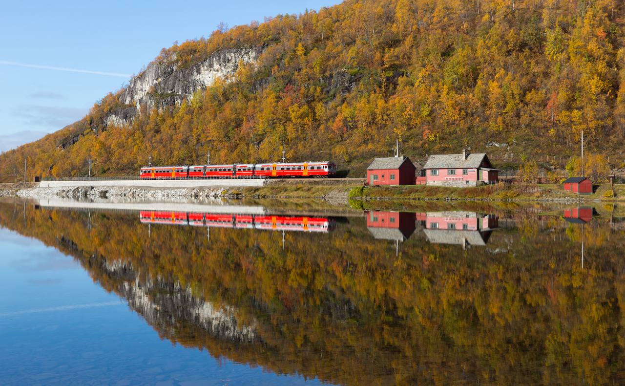 A passenger train on the Bergen Line beside Langavatnet between Vieren and Ørneberget, Norway.
