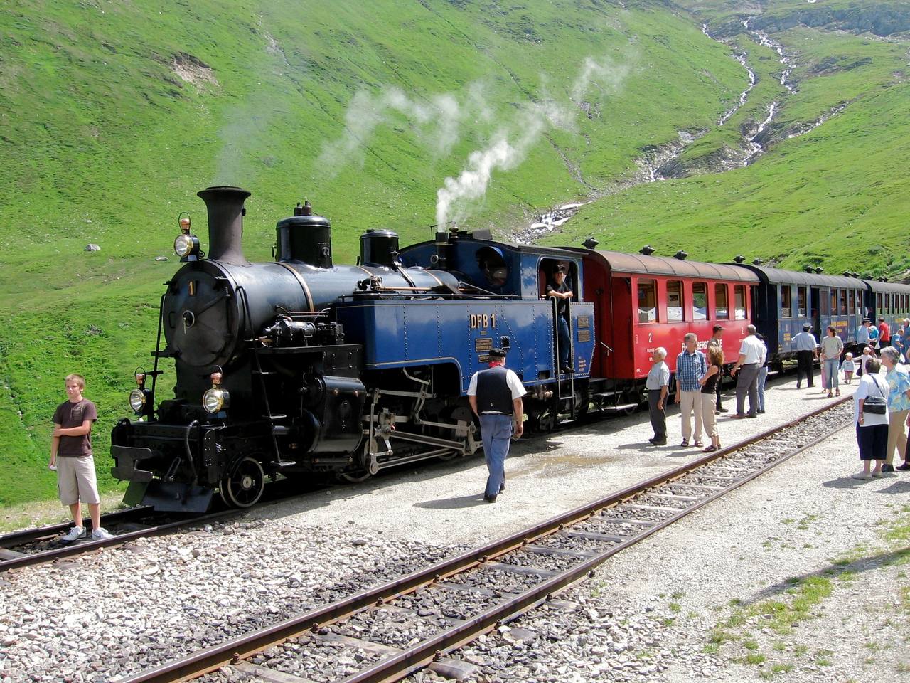 A Furka Steam Railway train at an intermediate stop on the restored Furka mountain route in Switzerland.