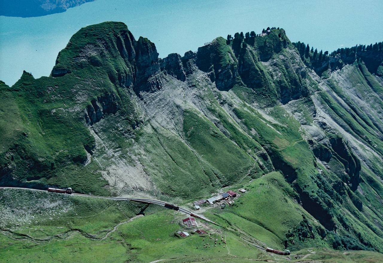 A steam train on the Brienz Rothorn Railway high above Planalp in the Swiss Alps.