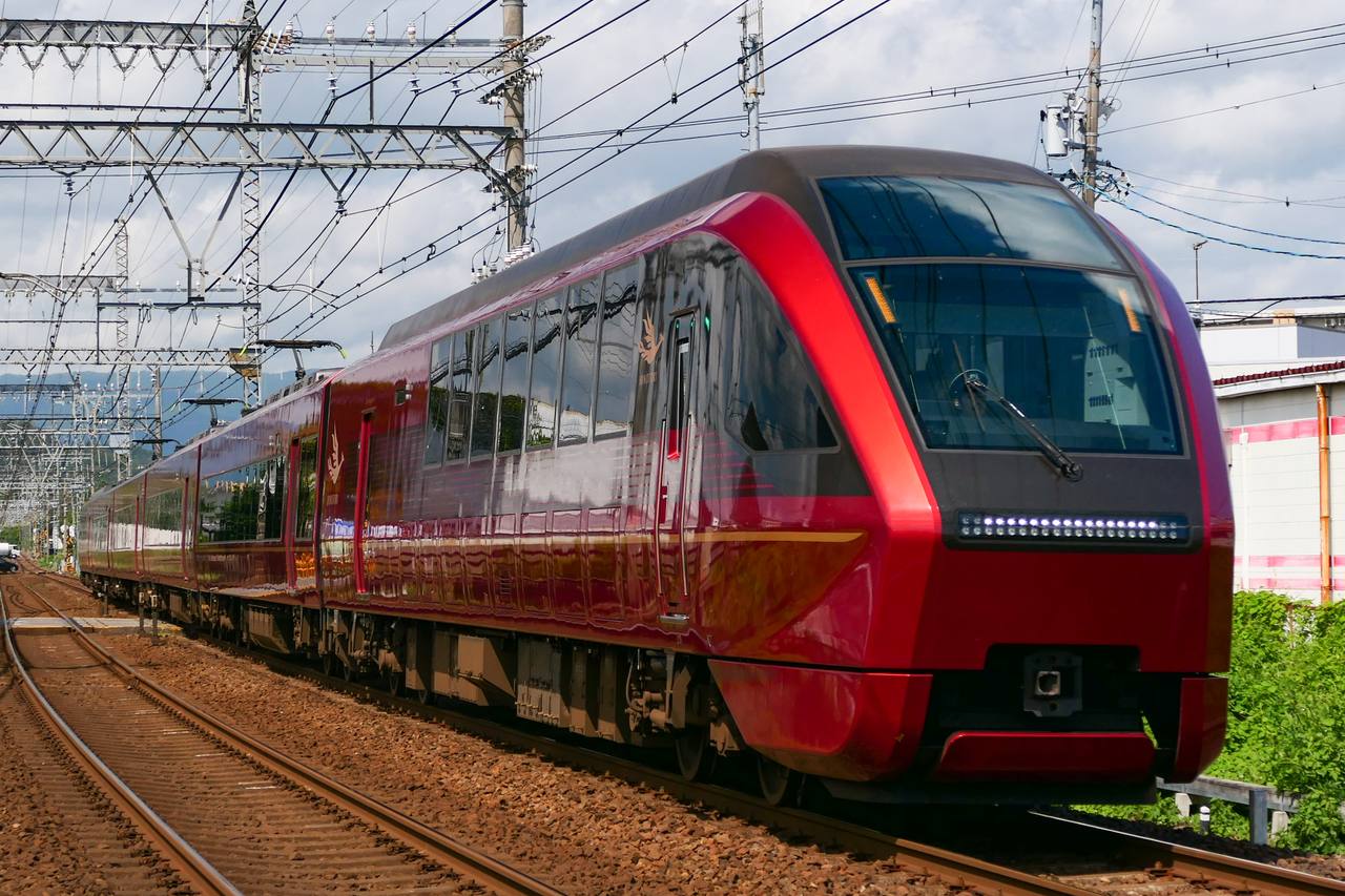 A Kintetsu 80000 series Hinotori limited express running in daylight.