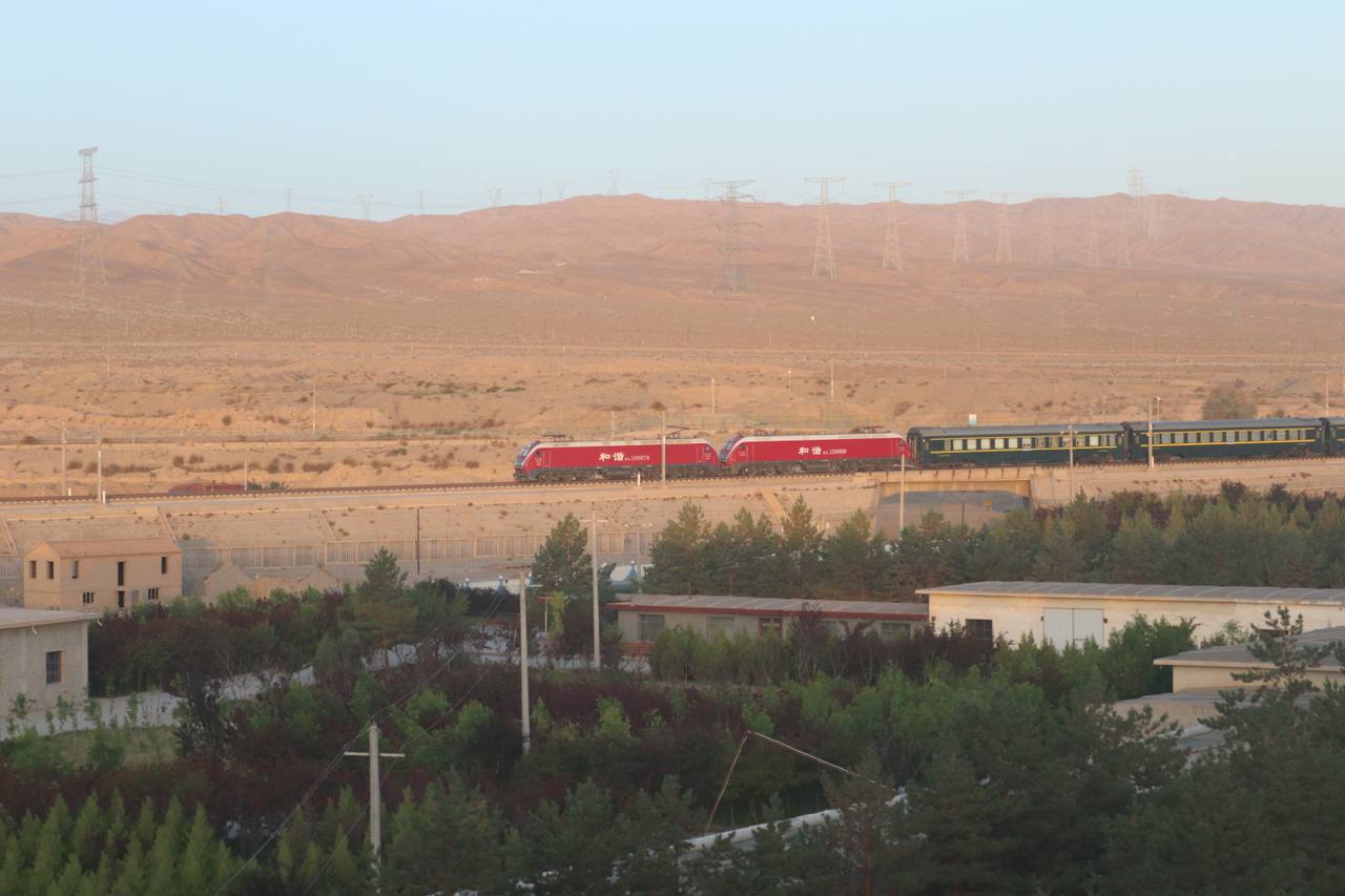A high-speed train on the Lanxin high-speed line approaching Jiayuguan South in the Gobi.