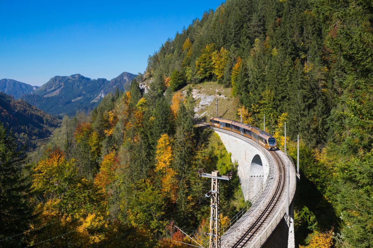A Mariazellerbahn train crossing the Saugraben viaduct in the Alps.