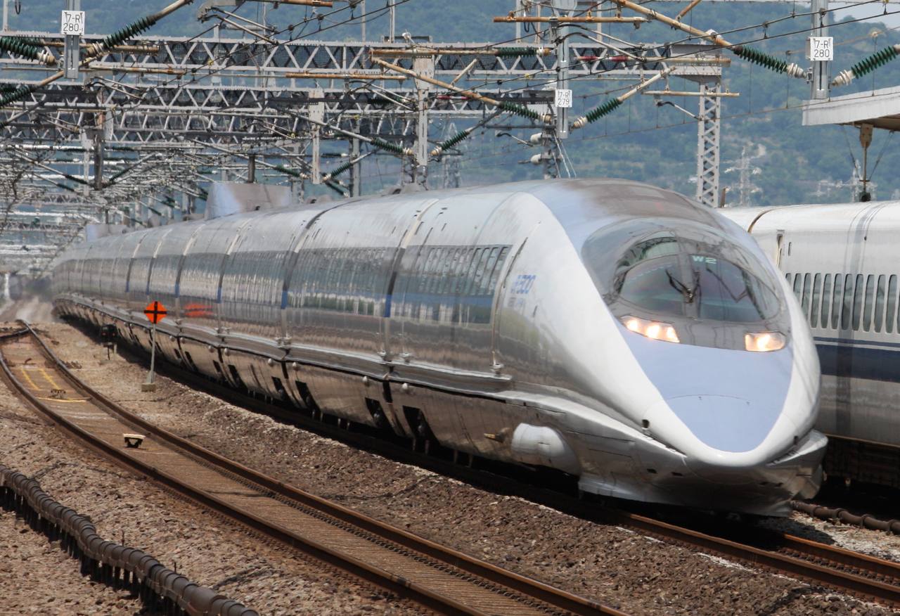 A 500 series Sanyo Shinkansen train runs through the countryside of western Japan.
