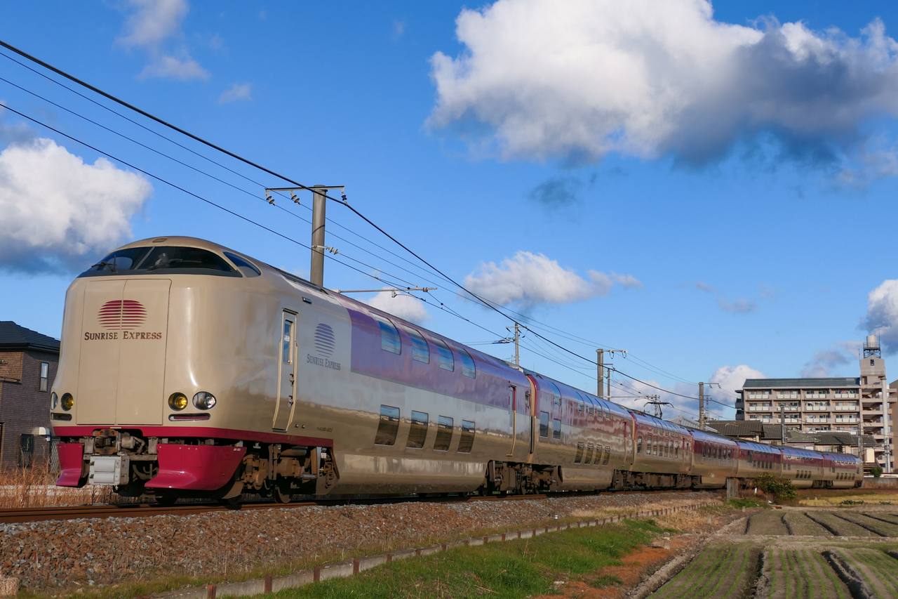 The Sunrise Seto sleeper train runs under open sky on its way to Takamatsu.