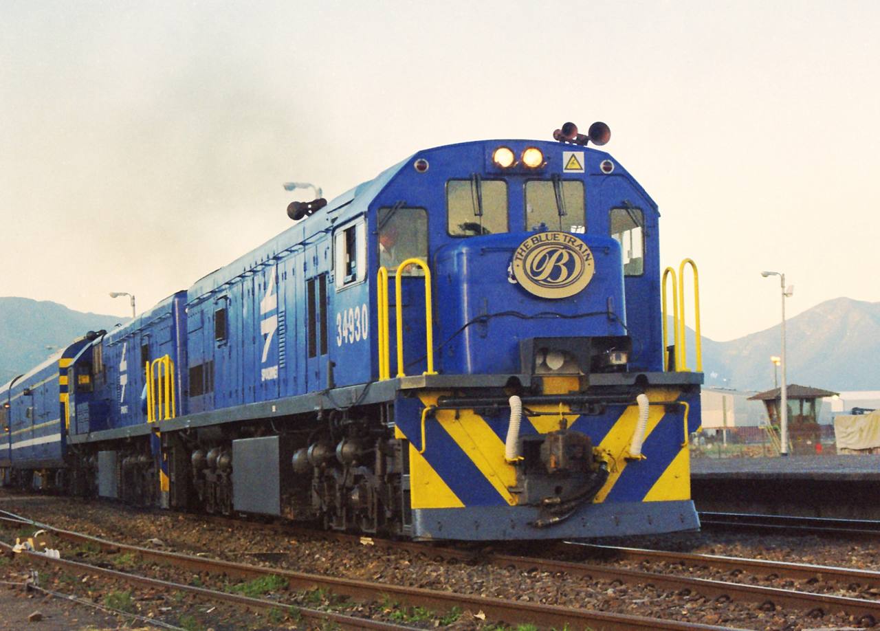 The Blue Train crosses the South African landscape behind a pair of Class 34 locomotives.