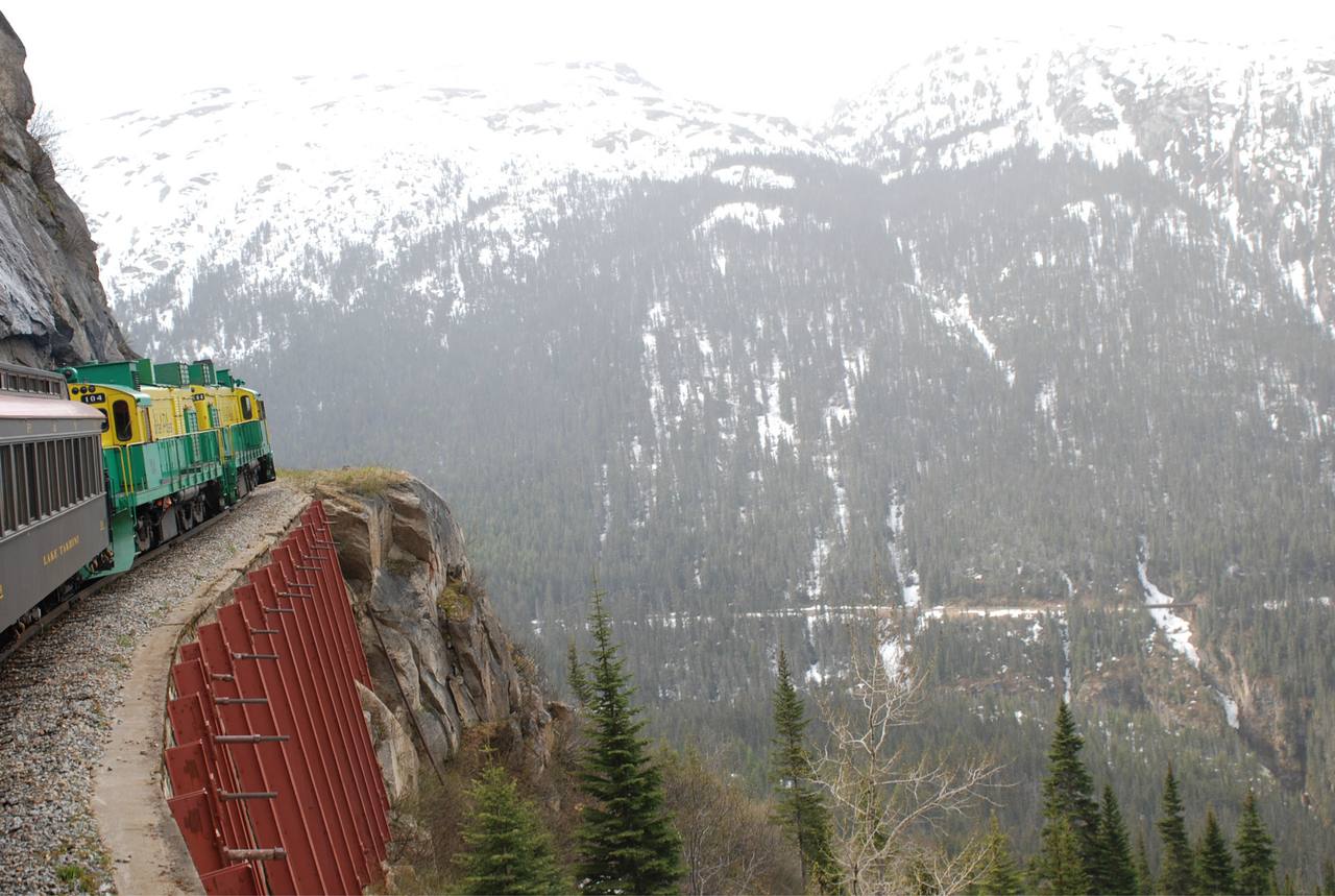 White Pass & Yukon Route locomotives and coaches climb the mountains above Skagway.
