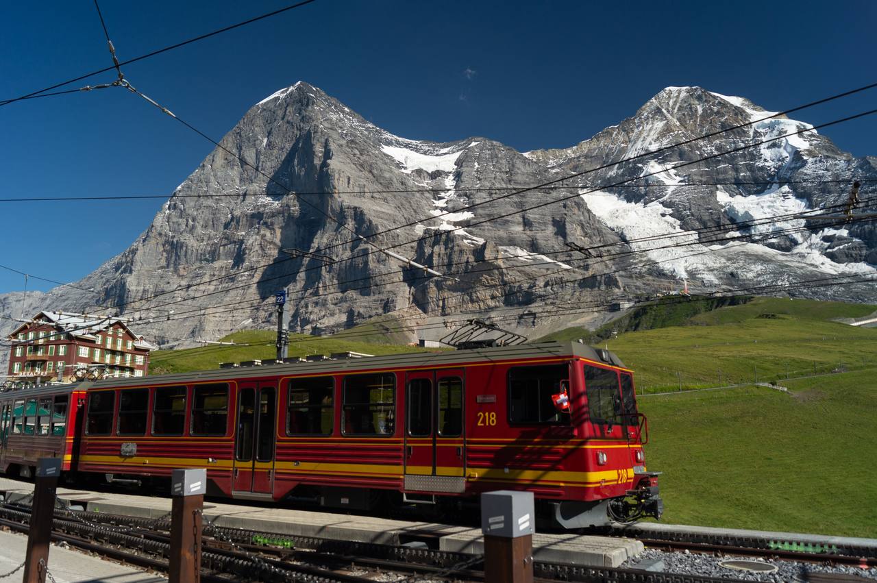 Jungfrau Railway train at Kleine Scheidegg with the Eiger north face behind it.