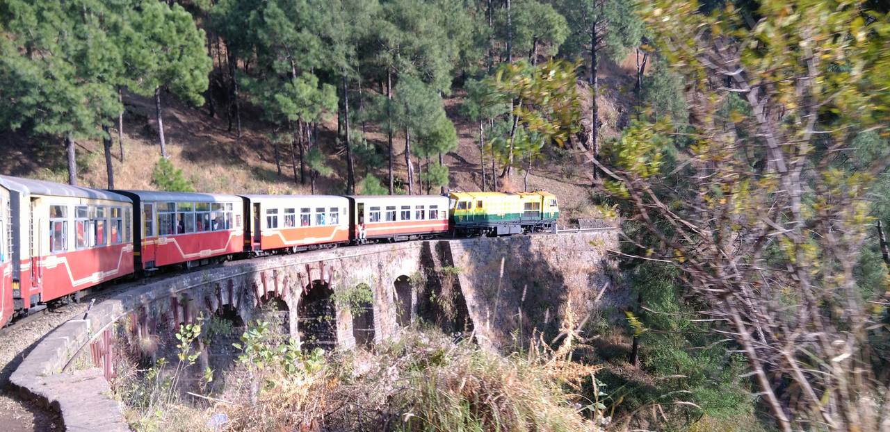 A narrow-gauge train on the mountainous Kalka–Shimla Railway in northern India.