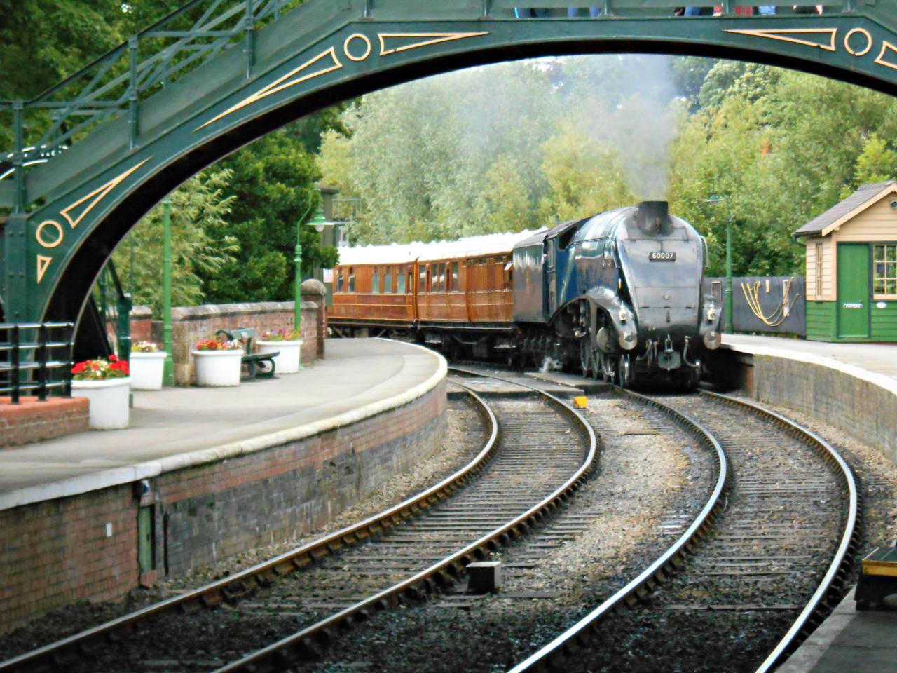 Steam locomotive and heritage railway scene at Pickering Station on the North Yorkshire Moors Railway in England.