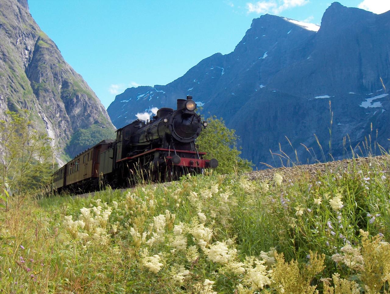 A passenger train on the Rauma Line between Dombås and Åndalsnes in Norway.