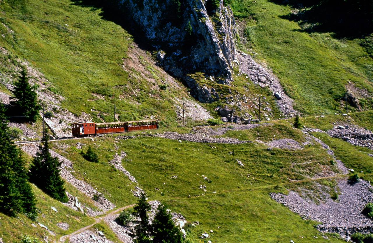 A Schynige Platte Railway electric rack locomotive and train in Switzerland.