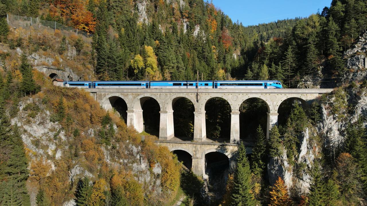 A passenger Railjet crossing the Krauselklause Viaduct on the Semmering Railway in Lower Austria.