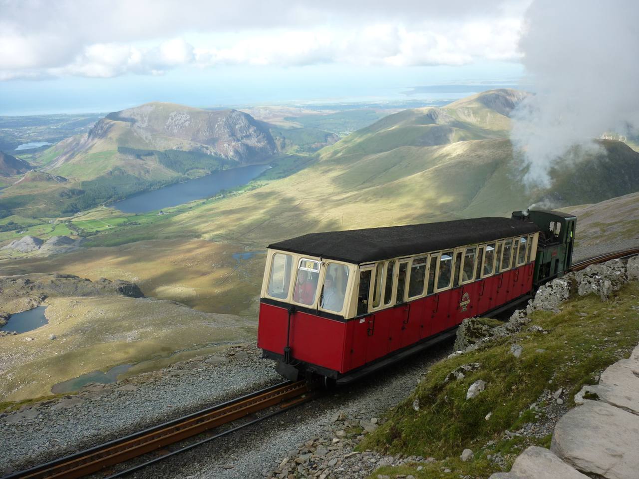 A Snowdon Mountain Railway train approaching the summit of Yr Wyddfa in Wales.