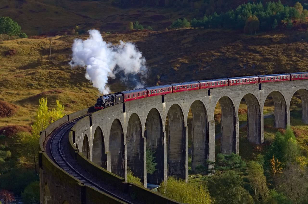 The Jacobite steam train crossing Glenfinnan Viaduct between Fort William and Mallaig.
