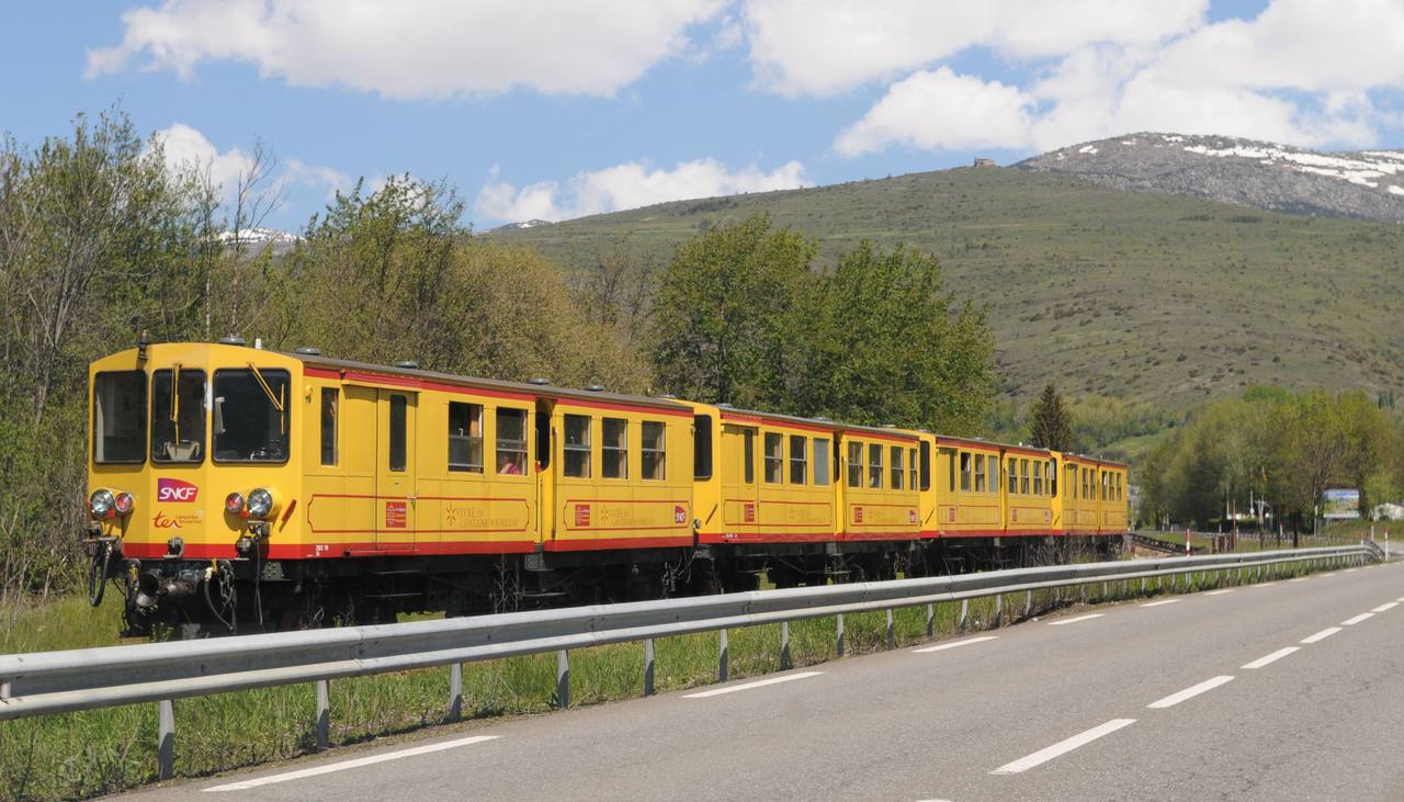 The Train Jaune travelling through the French Pyrenees on the Cerdagne line.