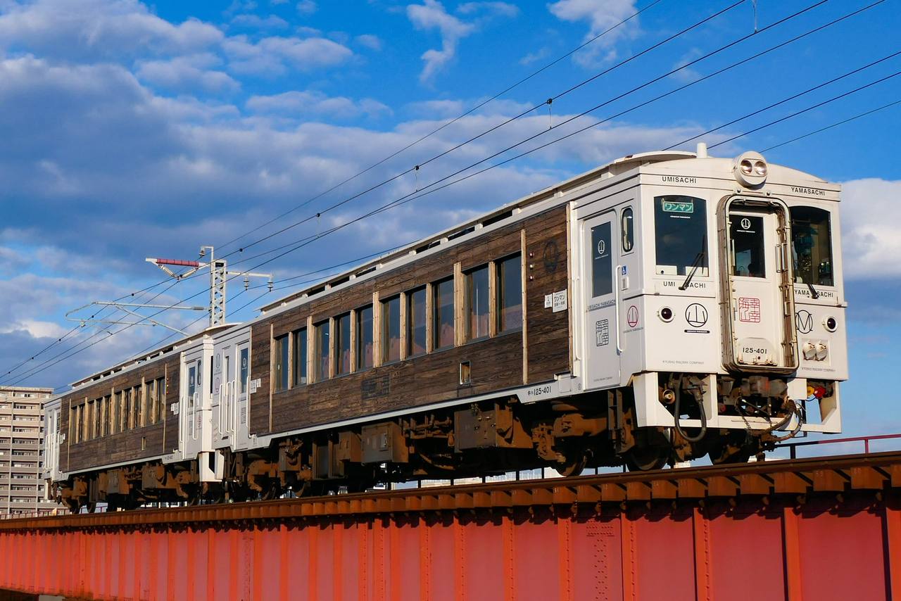 JR Kyushu Umisachi Yamasachi sightseeing train running between Miyazaki and Minami-Miyazaki in Japan.