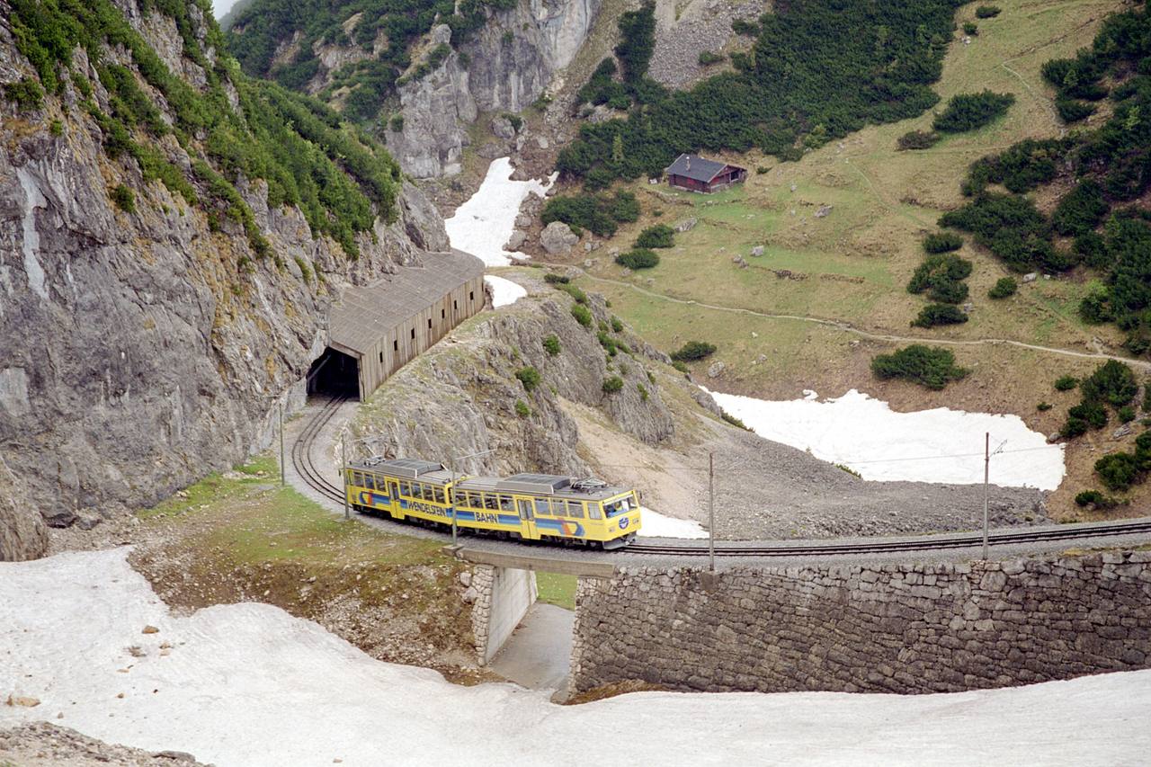 A Wendelstein Rack Railway railcar passing the Hohe Mauer between tunnels 5 and 6 in Bavaria.