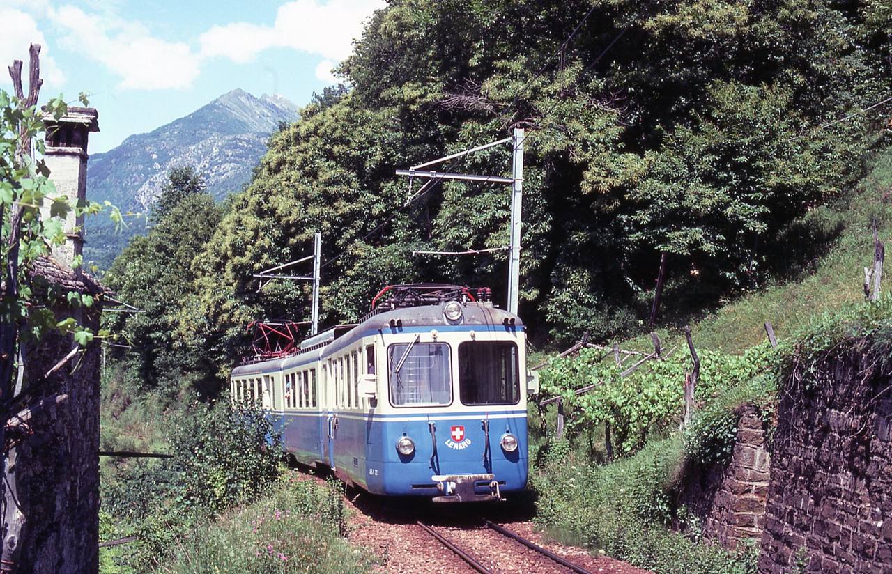 Centovalli Railway train climbing through the wooded Locarno–Domodossola valley.