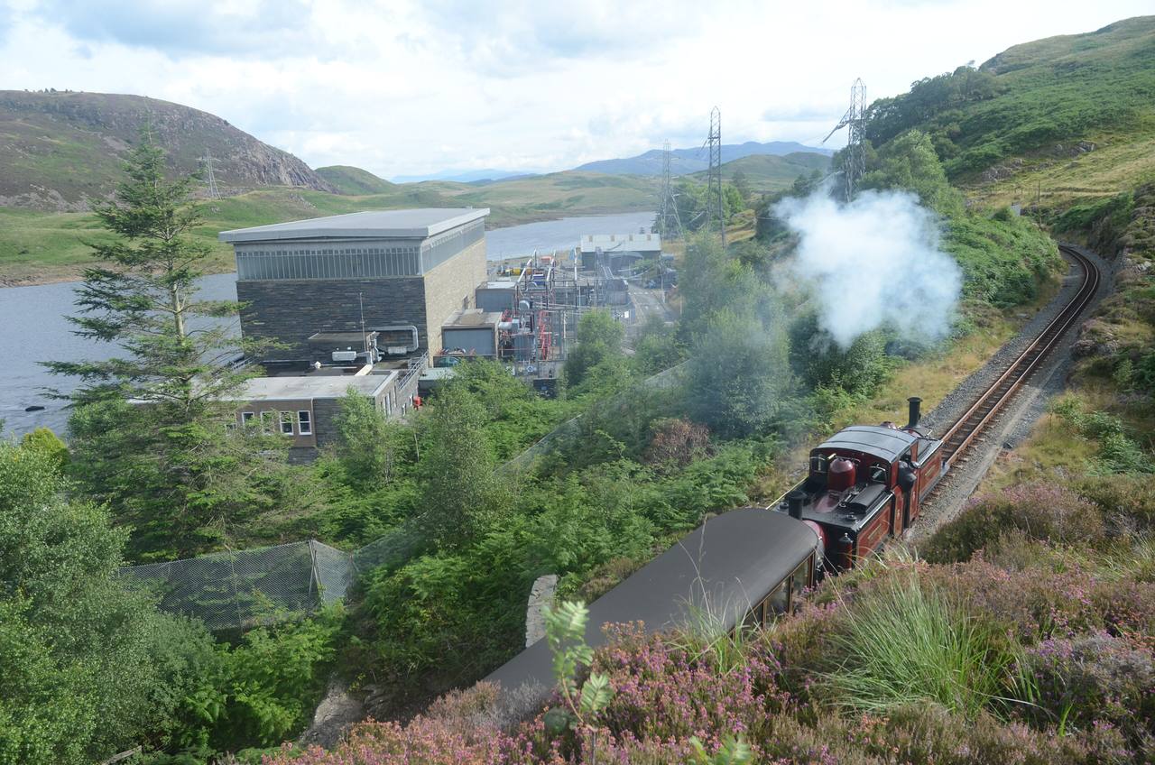 Ffestiniog Railway steam train crossing the Welsh uplands near Ffestiniog Power Station.