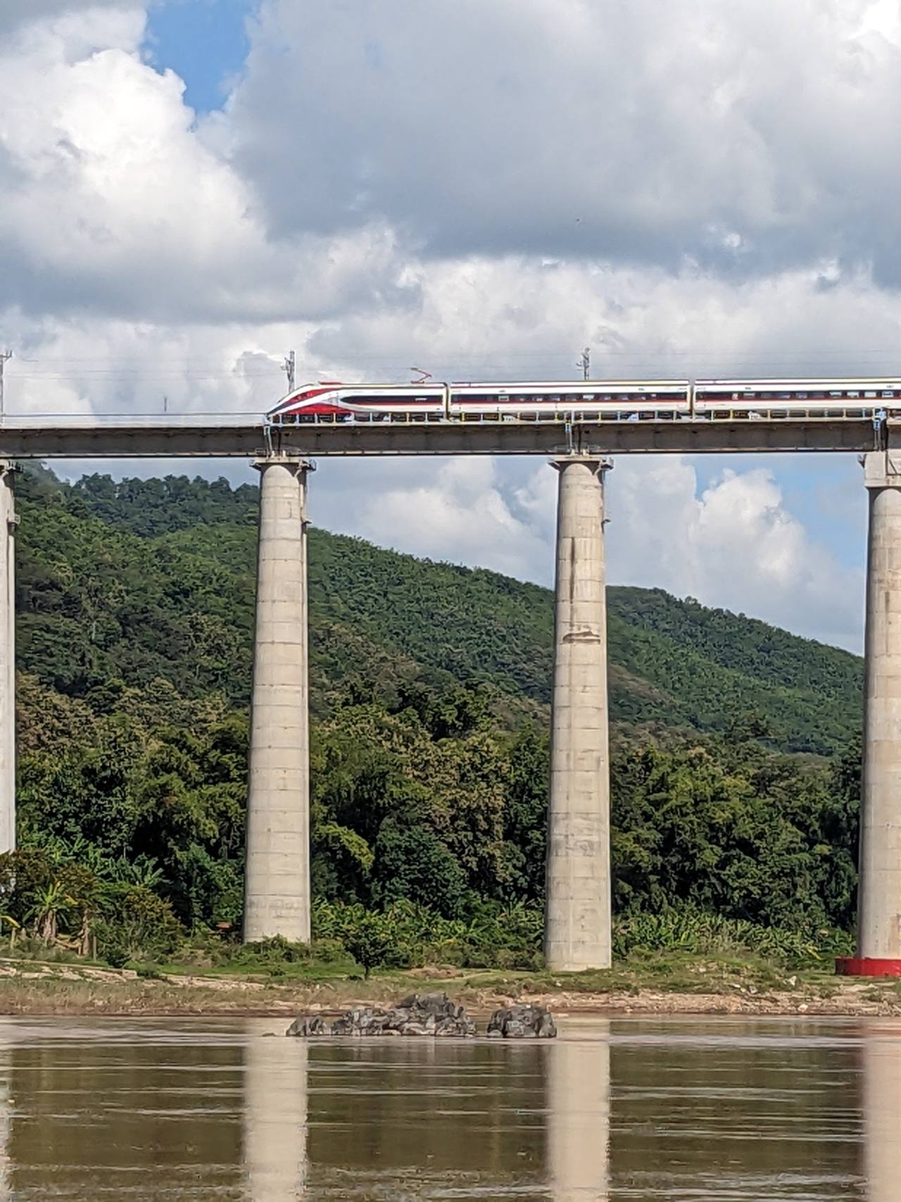 China–Laos Railway train crossing the Mekong River north of Luang Prabang.